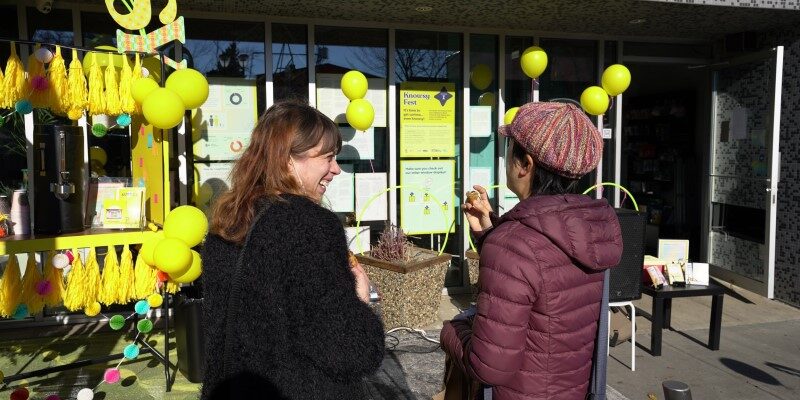 Women looking at billboard signs