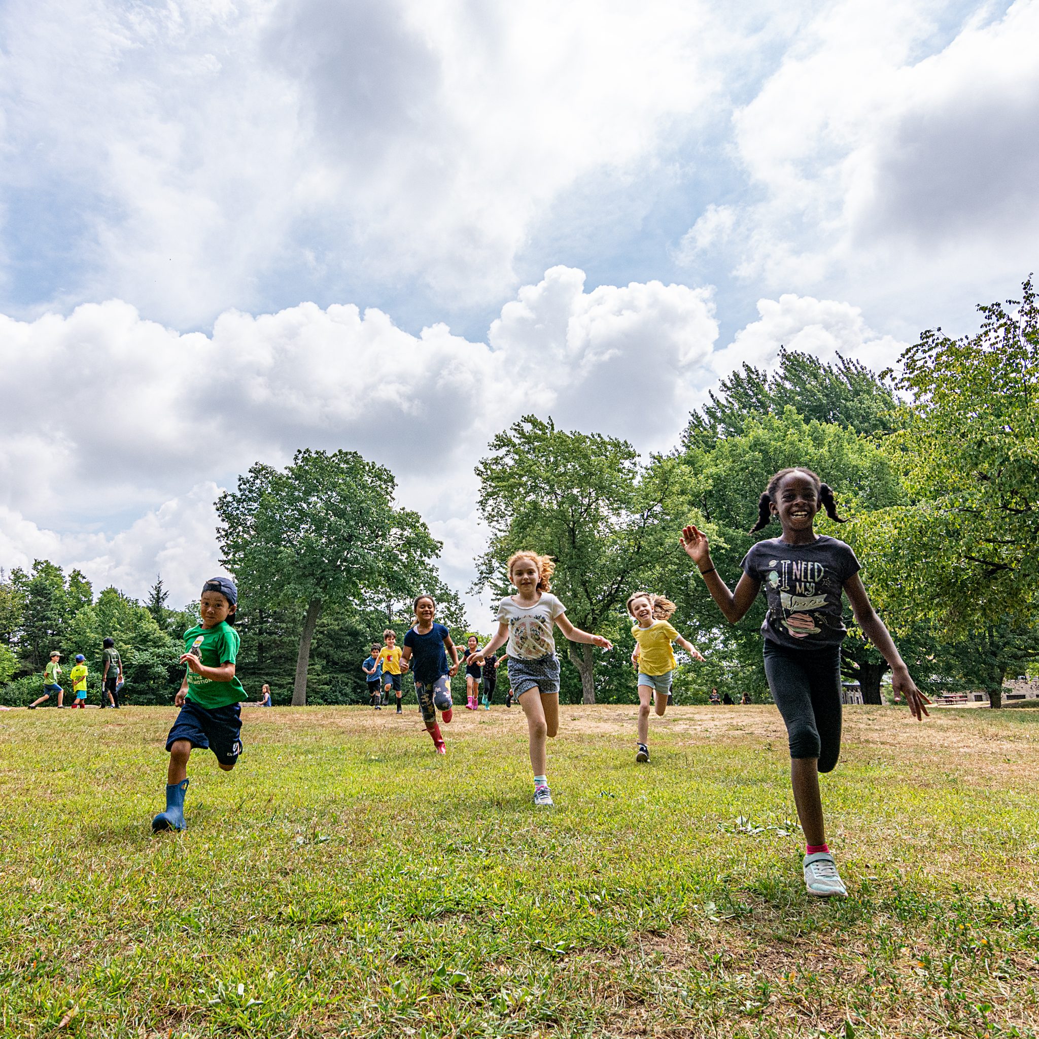 Kids running and playing in a park