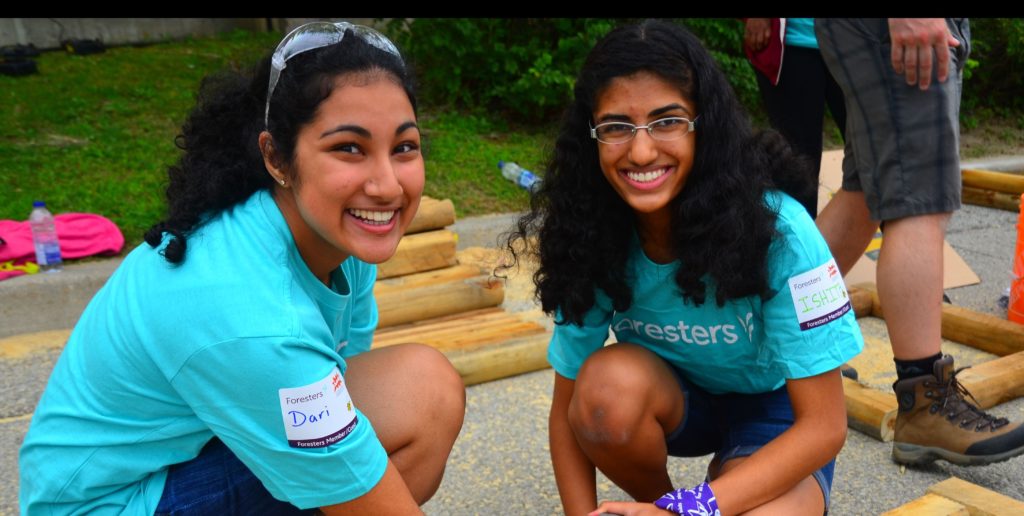 Two young girls smiling at the camera