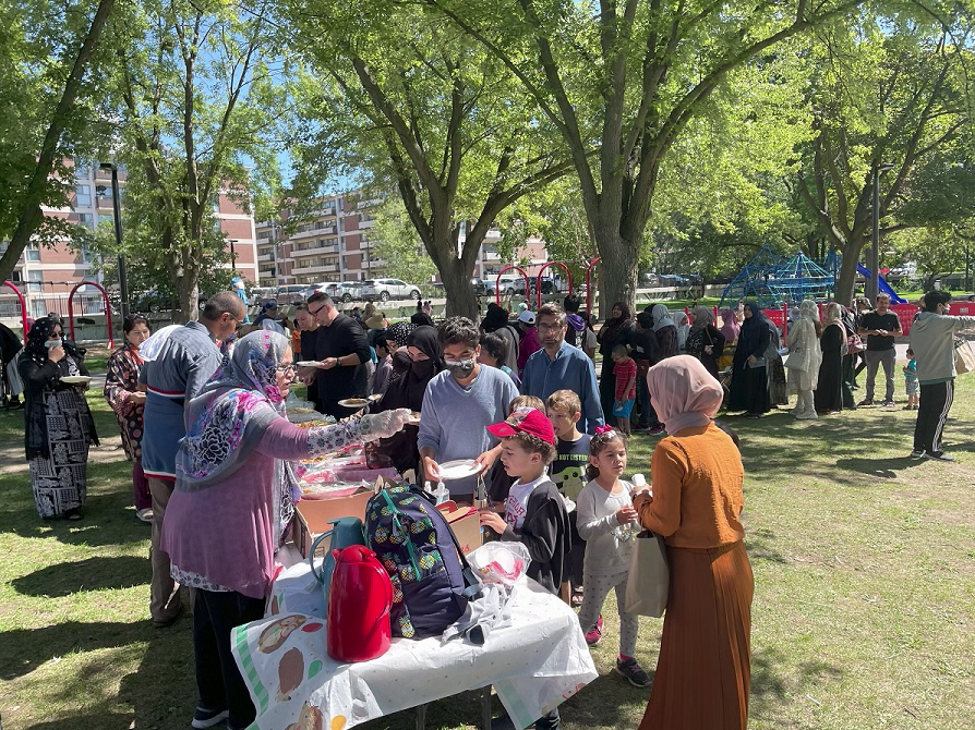 People sharing a meal in a park
