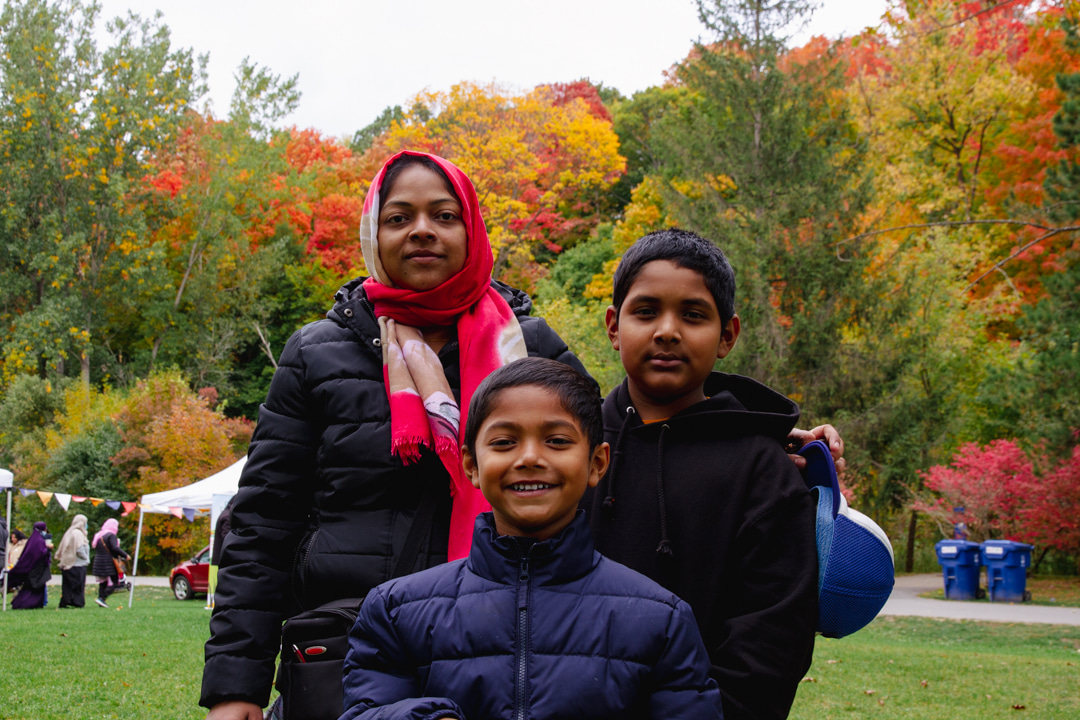 3 kids smiling at the camera