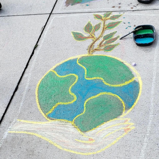 Drawing of planet earth hold by a hand